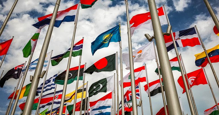 Image of a collection of national flags. SDG 16 & 17 deep dive