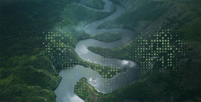 Meandering river, cutting through lush green hills