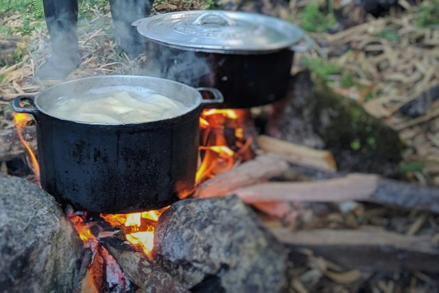 Image showing pots cooking on an open fire, Household Devices methodology